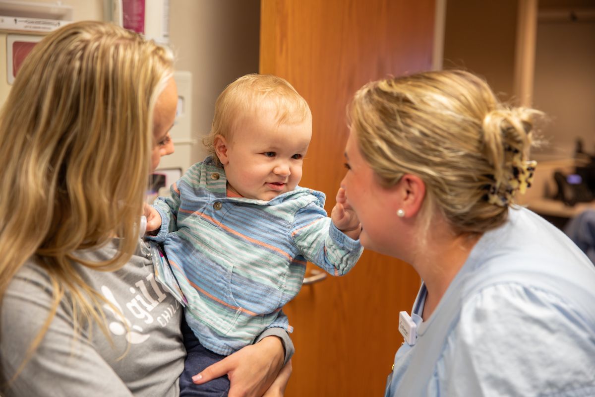 In a pre-op appointment Ekler charms certified pediatric nurse practitioner, Anna Rauch, and many other members of the Gillette craniofacial team.