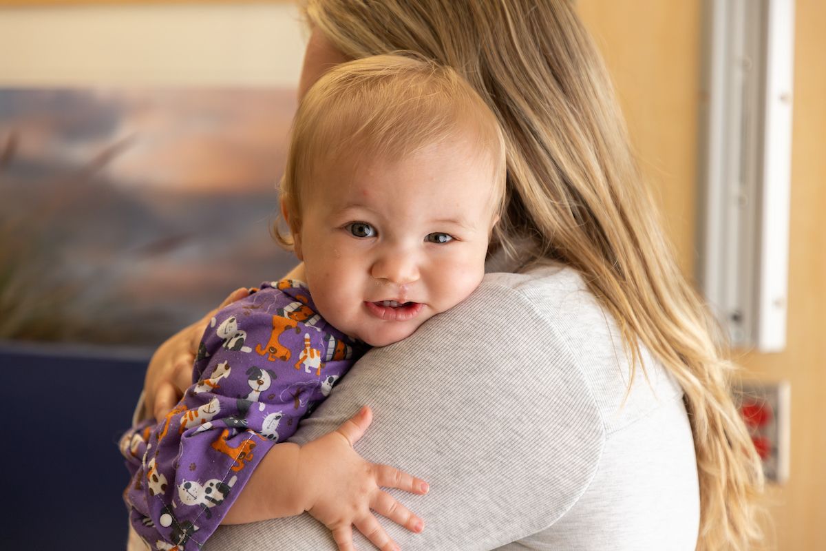 Ekler gets a hug from his mother before his cleft palate repair surgery