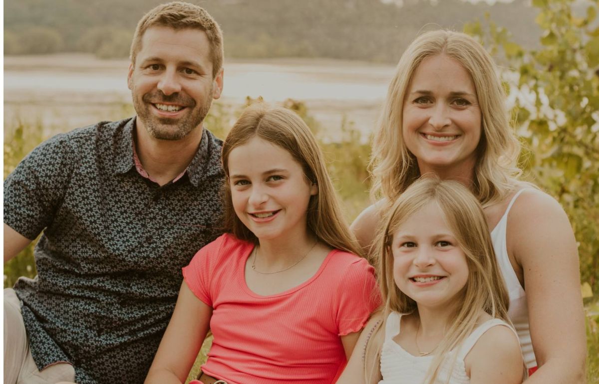 Kelsey Everson in a family portrait with her husband and two daughters.
