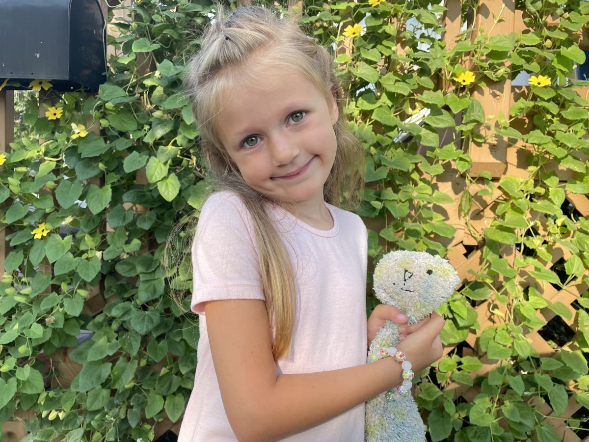 Gillette Children's SMA patient with stuffie toy.